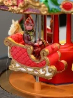 New Christmas Warehouse Kids Enjoying A Winter Fun Park Merry-Go-Round Christmas Village Scene - 23Cm